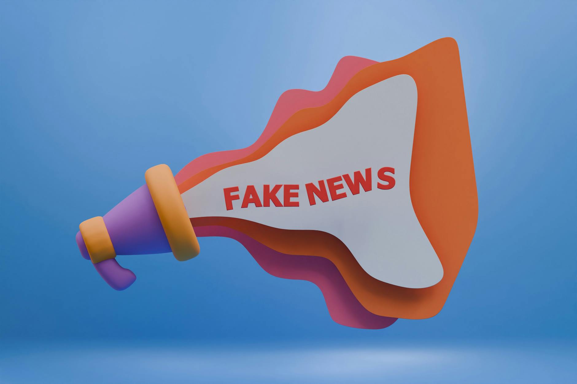 Kolorowy megafon z napisem Fake News symbolizujący fałszywe opinie